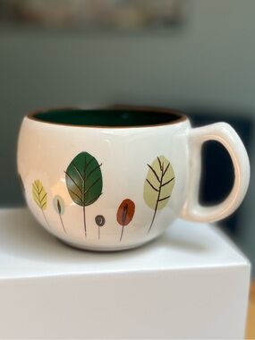 Starbucks White Ceramic Mug with Green Interior and Leaf Motif